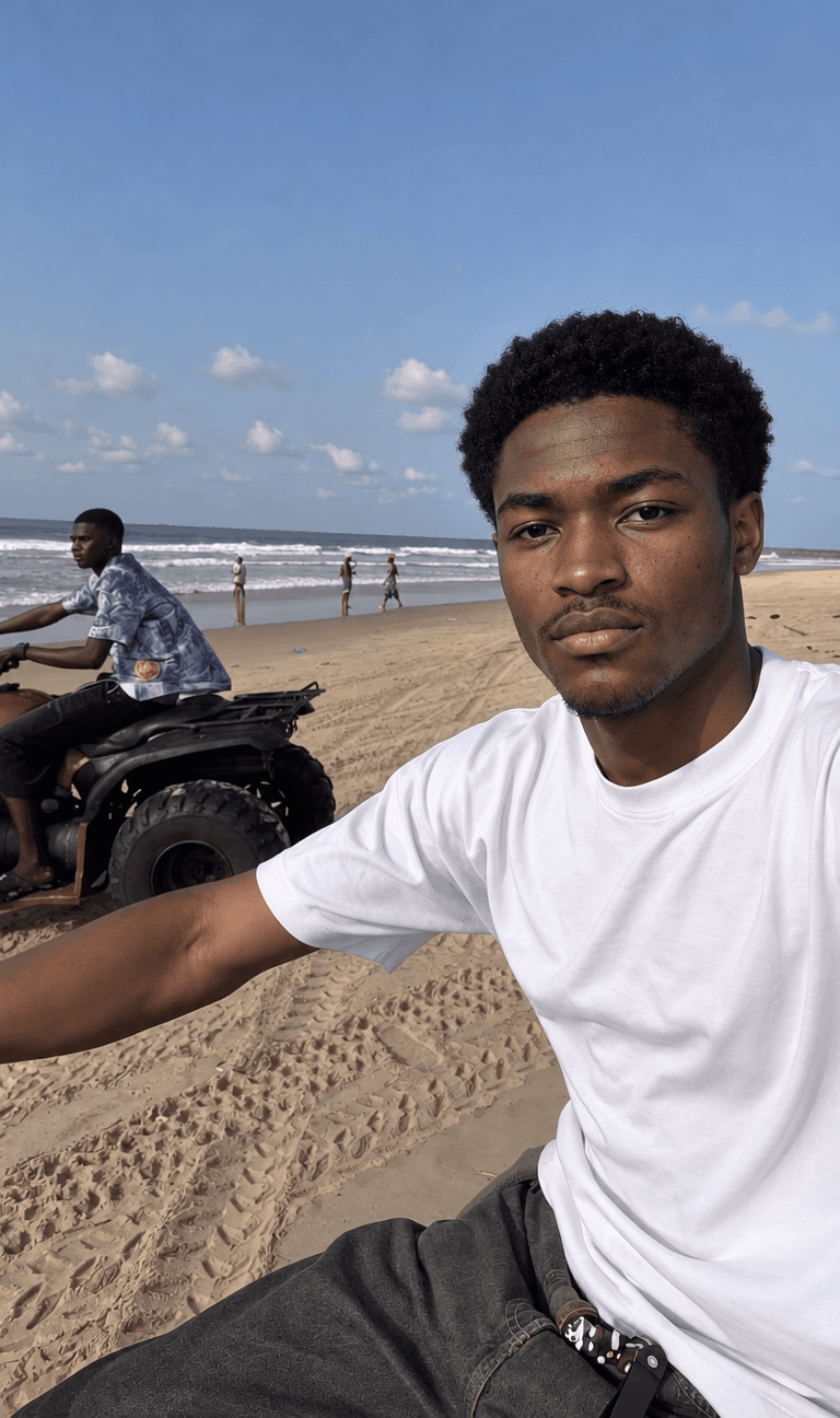 Man in a white T-shirt taking a selfie on a sunny beach